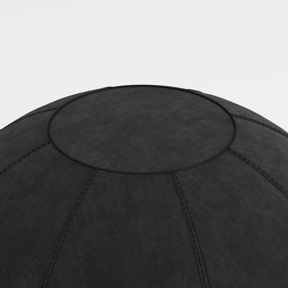 Black exercise ball on a light gray background
